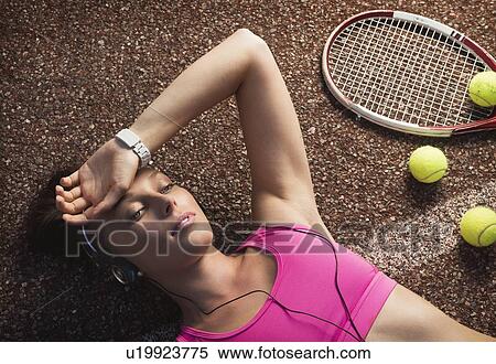 Tennis player laying on court View Large Photo Image Stock Photography - Tennis player laying on court. Fotosearch