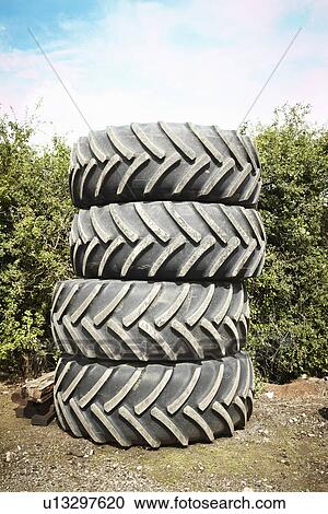 Tires stacked together in garden View Large Photo Image Stock Image - Tires stacked together in garden. Fotosearch