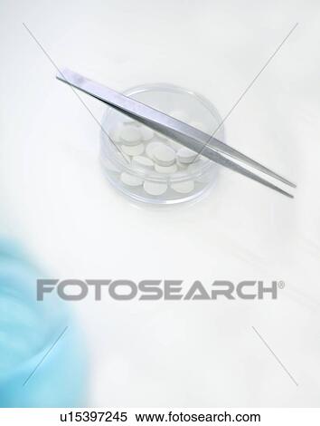 Tweezers and petri dish of pills View Large Photo Image Stock Photography - Tweezers and petri dish of pills. Fotosearch
