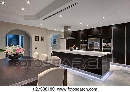 Vase of flowers in modern kitchen View Large Photo Image Stock Image - Vase of flowers in modern kitchen. Fotosearch
