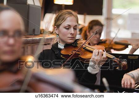 Violin player practicing with group View Large Photo Image Picture - Violin player practicing with group. Fotosearch