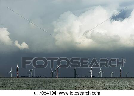 Wind turbines on coastline View Large Photo Image Picture - Wind turbines on coastline. Fotosearch