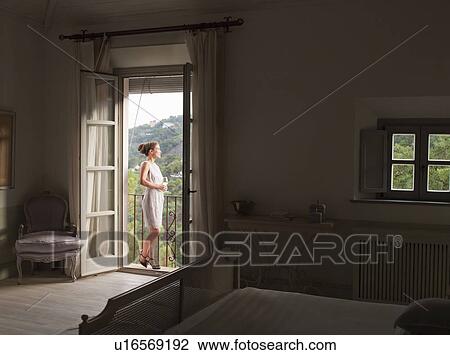 Woman admiring view from balcony View Large Photo Image Stock Image - Woman admiring view from balcony. Fotosearch