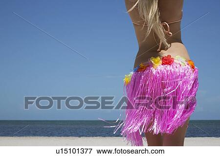 Woman grass skirt on beach View Large Photo Image Stock Photo - Woman grass skirt on beach. Fotosearch
