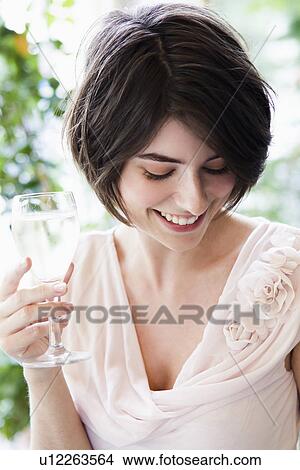 Woman having glass of wine outdoors View Large Photo Image Picture - Woman having glass of wine outdoors. Fotosearch