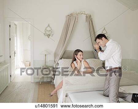 Woman having picture taken in bedroom View Large Photo Image Stock Image - Woman having picture taken in bedroom. Fotosearch