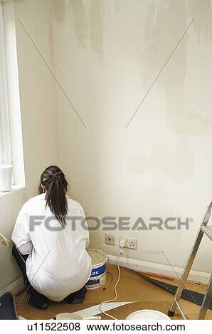 Woman painting room View Large Photo Image Stock Photo - Woman painting room. Fotosearch