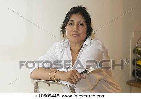 Stock Photography - Woman painting room. Fotosearch