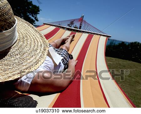 Woman relaxing on hammock View Large Photo Image Stock Image - Woman relaxing on hammock. Fotosearch