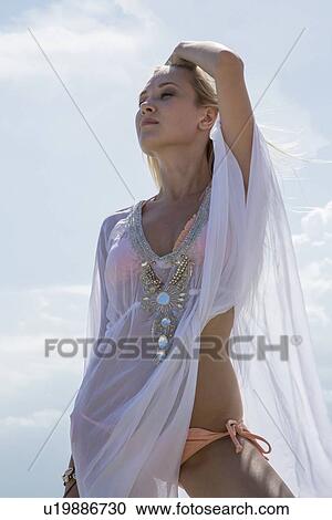 Woman wearing cover up outdoors View Large Photo Image Stock Image - Woman wearing cover up outdoors. Fotosearch