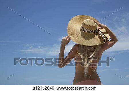 Woman wearing sunhat and bikini View Large Photo Image Stock Image - Woman wearing sunhat and bikini. Fotosearch