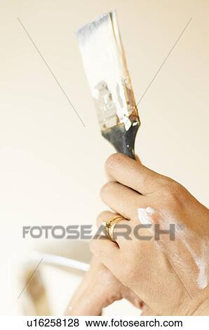 Womans paint stained hand and brush View Large Photo Image Stock Photo - Womans paint stained hand and brush. Fotosearch