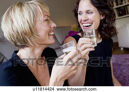 Women drinking champagne together View Large Photo Image Picture - Women drinking champagne together. Fotosearch