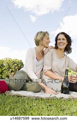 Women having picnic together outdoors View Large Photo Image Stock Photo - Women having picnic together outdoors. Fotosearch