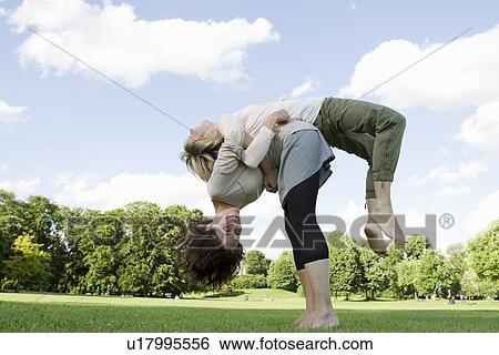 Women playing together in park View Large Photo Image Stock Photograph - Women playing together in park. Fotosearch