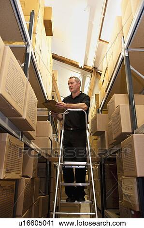 Worker stacking cardboard boxes View Large Photo Image Stock Image - Worker stacking cardboard boxes. Fotosearch