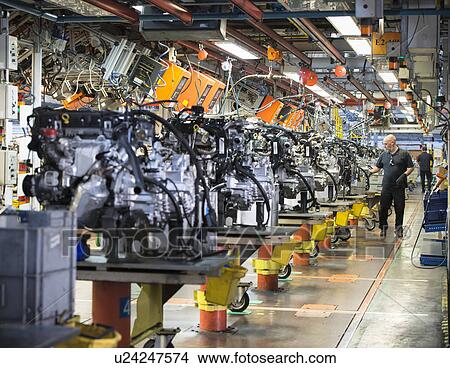 Workers on engine production line in car factory View Large Photo Image Picture - Workers on engine production line in car factory. Fotosearch