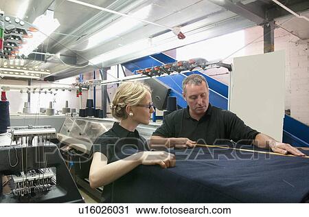 Workers talking in garment factory View Large Photo Image Stock Image - Workers talking in garment factory. Fotosearch