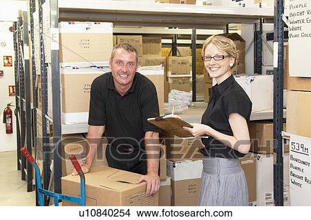 Workers talking in warehouse View Large Photo Image Picture - Workers talking in warehouse. Fotosearch