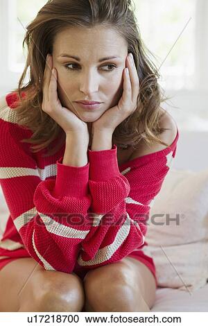 Worried woman resting chin in hands View Large Photo Image Stock Image - Worried woman resting chin in hands. Fotosearch