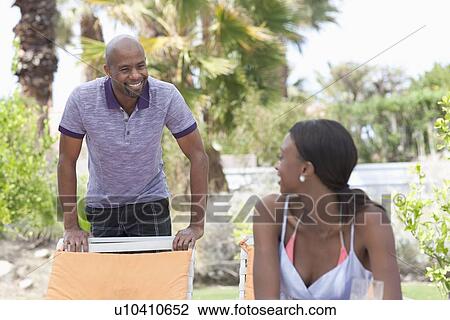 African American couple socializing around pool View Large Photo Image Stock Image - African American couple socializing around pool. Fotosearch