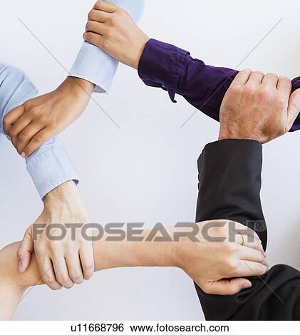 Stock Photograph - Arm circle made by office workers. Fotosearch