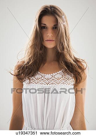 Beautiful woman staring into camera View Large Photo Image Stock Image - Beautiful woman staring into camera. Fotosearch