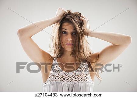 Stock Image - Beautiful woman stressed out. Fotosearch