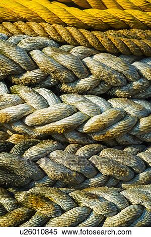 Stock Photography - Braided ropes in harbor, close-up. Fotosearch