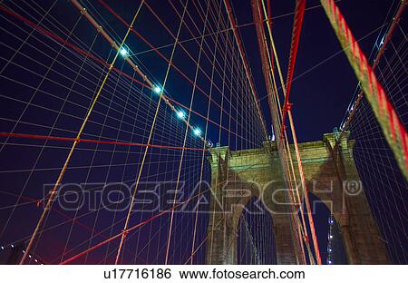 Stock Photograph - Brooklyn bridge at night. Fotosearch