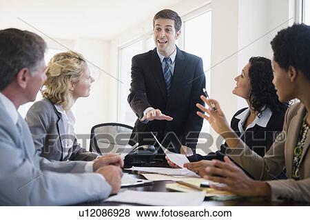Stock Photo - Business people at meeting. Fotosearch