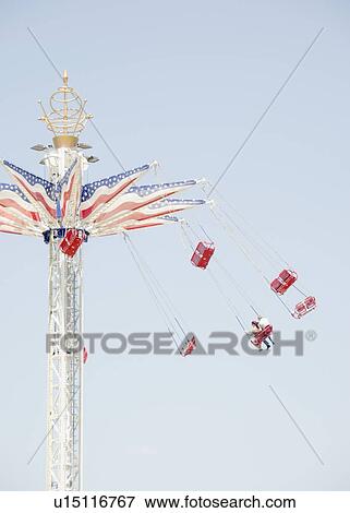 Carousel in amusement park View Large Photo Image Stock Photo - Carousel in amusement park. Fotosearch