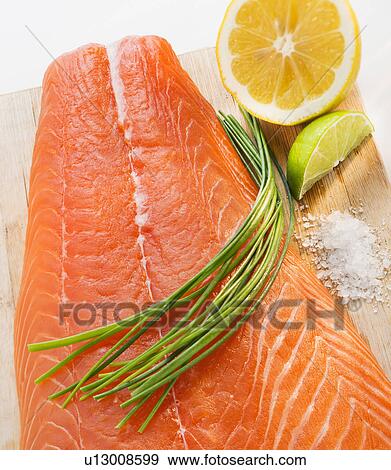 Stock Photo - Close up of raw salmon meat, studio shot. Fotosearch