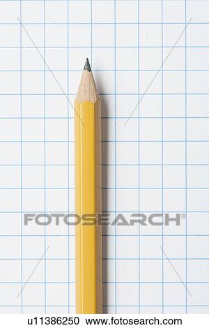 Close up of single yellow sharpened pencil on graph paper View Large Photo Image Stock Image - Close up of single yellow sharpened pencil on graph paper. Fotosearch