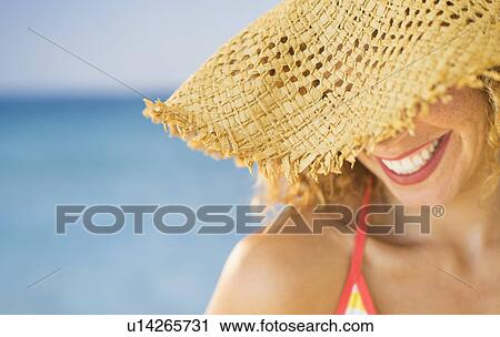 Close up of smiling woman in sun hat View Large Photo Image Stock Image - Close up of smiling woman in sun hat. Fotosearch