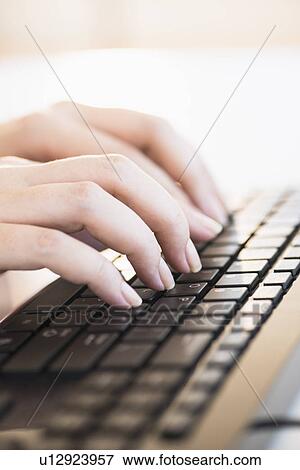 Close up of woman's hands typing on computer keyboard View Large Photo Image Stock Photo - Close up of woman's hands typing on computer keyboard . Fotosearch