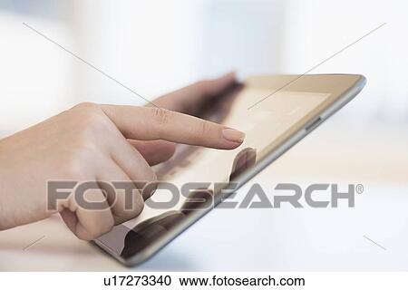 Close up of woman's hands using digital tablet View Large Photo Image Stock Image - Close up of woman's hands using digital tablet. Fotosearch