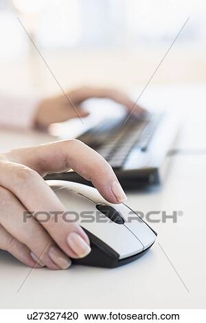 Close up of woman's hands using computer keyboard and computer mouse View Large Photo Image Stock Image - Close up of woman's hands using computer keyboard and computer mouse. Fotosearch