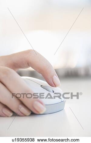 Close up of woman's hands using computer mouse View Large Photo Image Stock Photo - Close up of woman's hands using computer mouse. Fotosearch