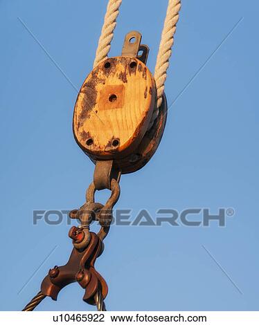 Stock Image - Close-up view of yacht rope against blue sky. Fotosearch