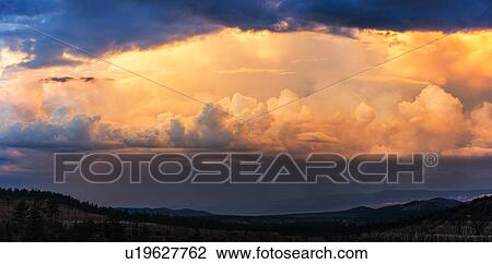 Clouds above valley at dusk View Large Photo Image Stock Image - Clouds above valley at dusk. Fotosearch