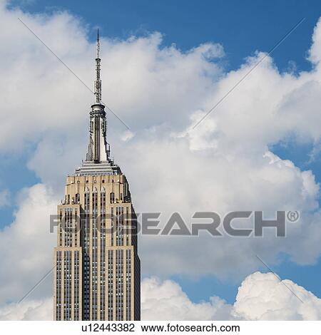 Empire State Building under blue sky View Large Photo Image Stock Image - Empire State Building under blue sky. Fotosearch