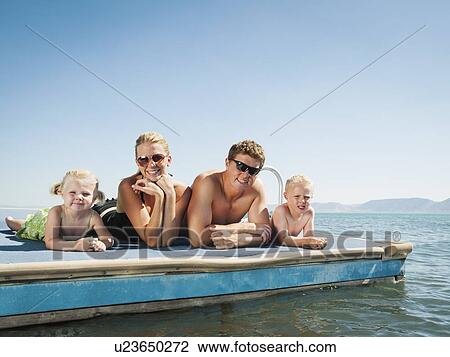 Family portrait on raft View Large Photo Image Stock Image - Family portrait on raft. Fotosearch