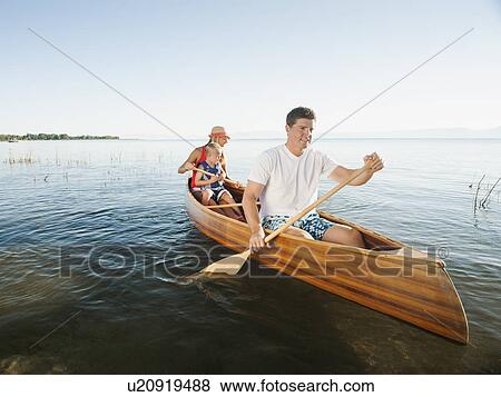 Stock Photo - Family with son (4-5) canoe traveling. Fotosearch