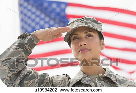 Female army soldier saluting, American flag in background View Large Photo Image Stock Image - Female army soldier saluting, American flag in background. Fotosearch
