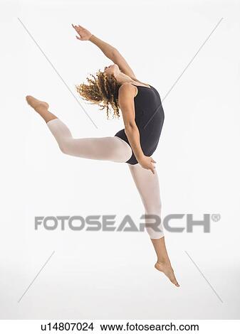 Female ballet dancer during practicing, studio shot View Large Photo Image Picture - Female ballet dancer during practicing, studio shot. Fotosearch