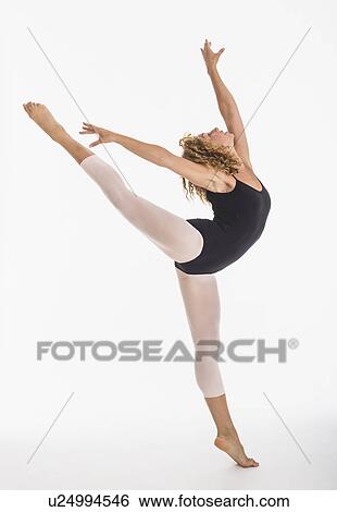 Female ballet dancer during practicing, studio shot View Large Photo Image Stock Photograph - Female ballet dancer during practicing, studio shot. Fotosearch