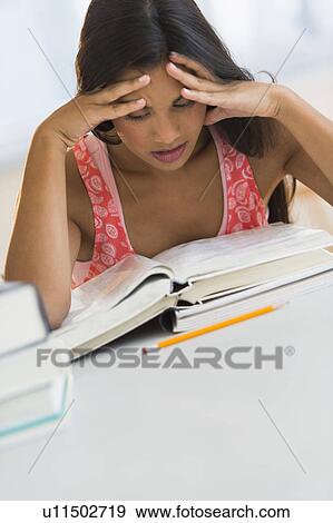 Female student reading book View Large Photo Image Stock Photo - Female student reading book. Fotosearch