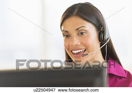 Stock Photo - Female telephone worker. Fotosearch
