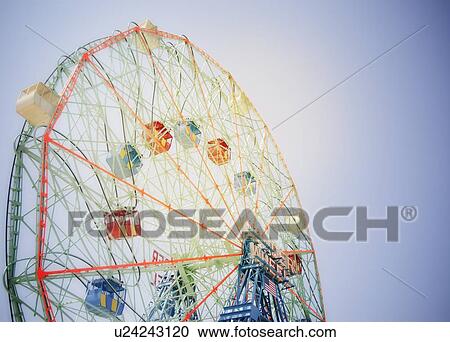 Ferris wheel in amusement park View Large Photo Image Stock Image - Ferris wheel in amusement park. Fotosearch